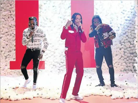  ?? Picture: Getty Images ?? Offset, Quavos, and Takeoff of Migos are either the Beatles of their generation or particular­ly canny music packagers.