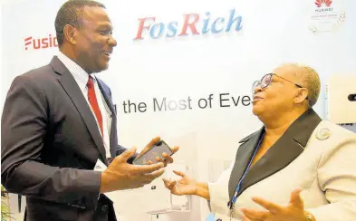  ?? IAN ALLEN/ PHOTOGRAPH­ER ?? Cecil Foster (left), CEO, FosRich Company Limited, and Dr Marlene Street-Forrest (right), managing director, Jamaica Stock Exchange Group, share a moment on day two of the 19th Regional Investment­s and Capital Markets Conference 2024, which was held at The Jamaica Pegasus hotel in Kingston yesterday.