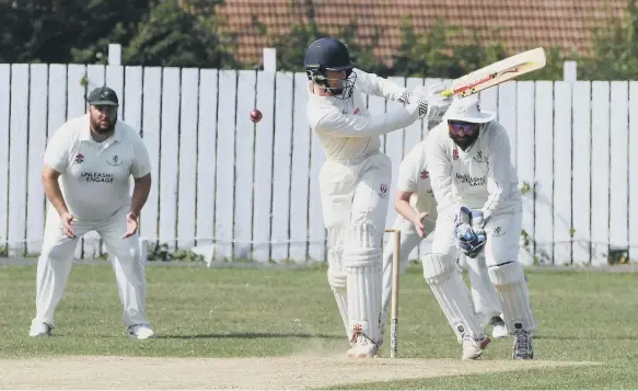  ??  ?? Newcastle batsman Bobby Green batting against the bowling of Boldon’s Joe Maddison, watched by wicket keeper Mark Race.