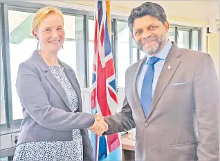  ?? Picture: FIJIAN GOVERNMENT ?? New Zealand High Commission­er Charlotte Darlow and Minister for Economy, Aiyaz Sayed-Khaiyum seal the deal with a hand shake.