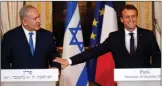  ?? The Associated Press ?? French President Emmanuel Macron, right, and Israeli Prime Minister Benjamin Netanyahu attend a press conference after a meeting Sunday at the Elysee Palace in Paris. Macron reaffirmed his “disapprova­l” of U.S. President Donald Trump’s move to...