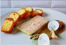  ??  ?? The cognac foie gras terrine takes Dominic over three days to prepare, but by God, it is worth it! This silky seductress is so good, you can even eat it on its own!