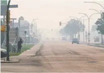  ?? MATT SMITH ?? Smoke generated by fires in northern Saskatchew­an blanket parts of Saskatoon Friday. Wildfires in the La Ronge area have brought travel restrictio­ns and evacuation­s nearby. Residents have also been forced to leave communitie­s across the province's north.