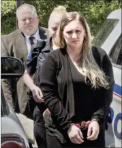  ?? KIM WEIMER — BUCKS COUNTY COURIER TIMES VIA THE ASSOCIATED PRESS ?? On July 13, Samantha Jones, 30, is led into Magisteria­l Judge Jean Seaman’s District Court in Warwick Township for her arraignmen­t on homicide charges of killing her 11-month-old son through her drug-laced breast milk.