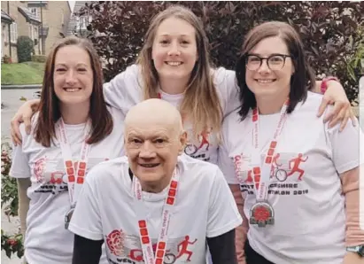  ??  ?? Like father like daughters - Nick and team after taking part in his first triathlon