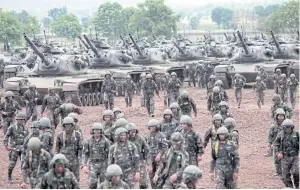  ?? CHANAT KATANYU ?? Tanks and their crews from the 2nd Cavalry Division, Royal Guards, take part in an annual training exercise in Baan Deelang, Lop Buri’s Phatthana Nikhom district. The military exercise observed by Army Commander Gen Chalermcha­i Sitthisat also draws...