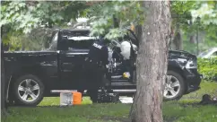  ?? ADRIAN Wyld / THE CANADIAN PRESS FILES ?? Police examine a pickup truck inside the grounds of Rideau Hall in Ottawa on July 2. Driver Corey Hurren of Manitoba pleaded guilty Friday to eight charges.