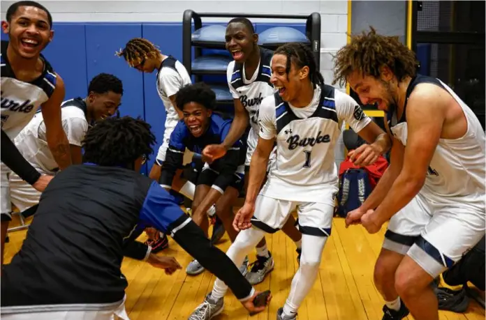  ?? ?? Clockwise from top left:
Student engagement counselor Shawn Brown watched over a hallway between classes at the Burke. Sophomores Isaac Dowden (left) and Nyla Bass said goodbye at the end of the school day. The Burke Bulldogs celebrated a victory over the Charlestow­n Townies.