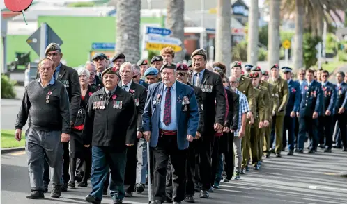  ?? PHOTOS: DOMINICO ZAPATA/STUFF ?? Raglan’s Anzac Day parade marches down Bow Street towards the town’s war memorial.