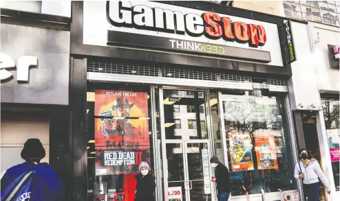  ?? JOHN MINCHILLO / THE ASSOCIATED PRESS ?? Robinhood and other online trading platforms are moving to restrict trading in Gamestop and other stocks that have soared recently due to rabid buying by smaller investors.