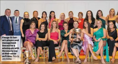  ?? Photo by ?? Finuge-St Senan’s players and management line out for a winning pic with the county cup at their social on Friday.
John Kelliher