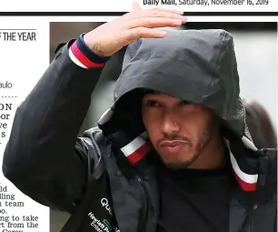  ?? GETTY IMAGES ?? Raining champion: Lewis Hamilton takes cover