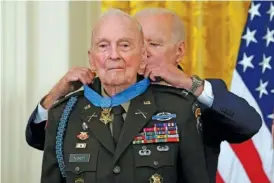  ?? AP PHOTO/ALEX BRANDON ?? In 2021, President Joe Biden presents the Medal of Honor to retired U.S. Army Col. Ralph Puckett, in the East Room of the White House in Washington.