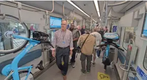  ?? CHRIS KOHLEY / MILWAUKEE JOURNAL SENTINEL ?? The public was invited to attend The Hop open house at the streetcar maintenanc­e facility under the I-794 expressway. Visitors explored one of five electric streetcars that fit up to 150 people. See more photos at jsonline.com/news.