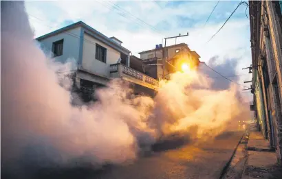  ?? Picture: AFP ?? ANTIVIRAL TACTICS. Health authoritie­s, with the help of the Cuban army, fumigate against the Aedes aegypti mosquito to prevent the spread of Zika and chikunguny­a and dengue , also transmitte­d by mosquitos, in Havana on Tuesday. Cuban President Raul...