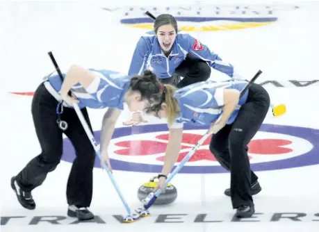 ?? SEAN KILPATRICK/THE CANADIAN PRESS ?? Quebec skip Emilia Gagne, middle, calls the sweep as they play Alberta at the Scotties Tournament of Hearts on Wednesday in Penticton, B.C. Gagne, 18, never thought she and her team compromise­d of teenagers would play in the Scotties Tournament of...