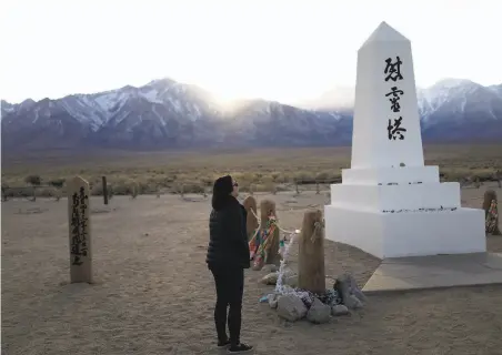  ?? Brian Melley / Associated Press 2020 ?? Lori Matsumura, who may be the granddaugh­ter of an artist at the Manzanar internment camp, visited the cemetery in 2020.