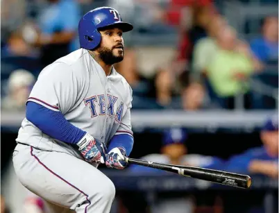  ?? Associated Press ?? above Texas Rangers’ Prince Fielder watches his eighth-inning RBI-double against the New York Yankees on June 28 in New York.