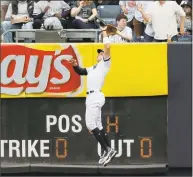  ?? Seth Wenig / Associated Press ?? Yankees right fielder Aaron Judge catches a sac fly hit by the White Sox’s Jose Abreu during the fifth inning Sunday at Yankee Stadium.