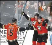  ?? Associated Press ?? Ducks forward Troy Terry (right) celebrates his goal with teammates Ryan Getzlaf (left) and Sonny Milano during the third period against the Montreal Canadiens on Sunday in Anaheim.