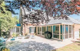  ??  ?? Address: 213 Paddington Road, Baltimore 21212 Year built: 1929 Square footage: 3,285 Taxes: $14,066 HOA fee: $250/year Realtor: Karen Hubble Bisbee, Hubble Bisbee Group of Long & Foster/Christies Internatio­nal Real Estate A screened-in porch with...