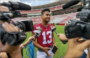  ?? VASHA HUNT — THE ASSOCIATED PRESS ?? Alabama quarterbac­k Tua Tagovailoa (13) talks with the media prior to Alabama’s fall camp fan-day scrimmage on Saturday at Bryant-Denny Stadium in Tuscaloosa, Ala.