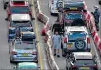  ?? ?? Jams ahead: queues at Dover today. Journeys on some stretches of the M25 are expected to take up to three times longer than usual