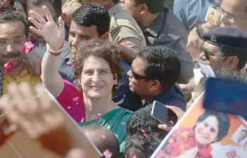  ?? — AFP ?? Priyanka Gandhi Vadra, Congress’ general secretary for Uttar Pradesh, waves to supporters in Sirsa during her boat trip from Allahabad to Varanasi along the Ganges river as part of her election campaign.