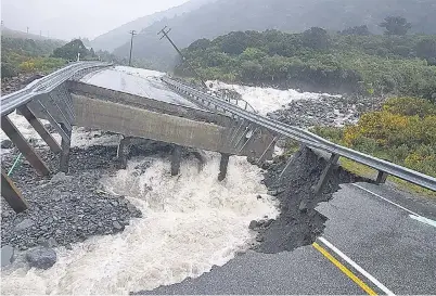  ?? PHOTO: SUPPLIED ?? Washout . . . A section of Goat Creek bridge near Otira is swept away by rising floodwater­s as a wet and wild weather system lashed parts of the West Coast yesterday.
