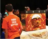  ??  ?? Students examine the Truth and Reconcilia­tion Commission of Canada’s bentwood box, which was used to collect items from residentia­l school survivors.