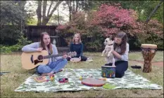  ?? COURTESY OF BRYAN PIRAS VIA AP ?? In this April 10 image from video, music therapists for St. Jude Children’s Research Hospital (from left) Celeste Douglas, intern Abigail Parrish and Amy Love record a session in Love’s backyard in Memphis, Tennessee.