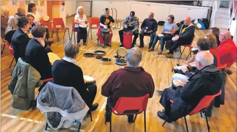  ??  ?? Participan­ts enjoy an African drumming workshop hosted by North Ayrshire Wellbeing and Recovery College.