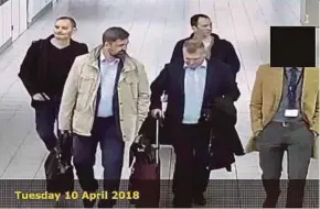  ?? AFP PIC ?? A picture provided by the Dutch Defence Ministry showing four Russian hacking suspects arriving in Amsterdam on April 10.