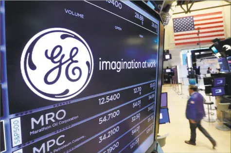  ?? Associated Press file photo ?? General Electric said Thursday it expects to absorb two more years of losses from its GE Capital division based in Norwalk, before hitting breakeven as insurance losses ebb and it finds buyers for some of GE Capital’s portfolio of loans.