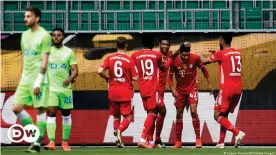  ??  ?? Jamal Musiala celebrates his second goal against Wolfsburg with his Bayern teammates