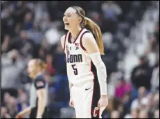  ?? Associated Press ?? UConn guard Paige Bueckers smiles during the first half against Georgetown in the finals of the Big East Conference tournament at Mohegan Sun Arena, Monday, in Uncasville, Conn.