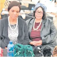  ??  ?? Nomathemba Xakaza and Lindiwe Buthelezi make slippers in Mashona Village