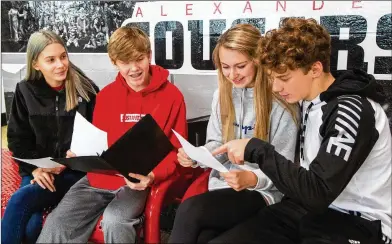  ??  ?? Anna Caputo (from left), Sutton Cadman, Gracie Chaves and Carson Hucks are part of the Alexander High School Habitat for Humanity chapter in Douglasvil­le that is leading their community to raise $90,000 to build a home for a veteran.