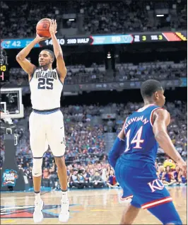  ?? DAVID J. PHILLIP – THE ASSOCIATED PRESS ?? Villanova guard Mikal Bridges, left, has made 101 of 232 3-point attempts (43.5 percent) this season, leading a Wildcats team that has made 454 3-pointers this season, breaking an 11-year-old college record.