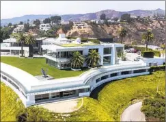  ?? Allen J. Schaben Los Angeles Times ?? AN AERIAL view of The One, a 105,000-square-foot mansion developed by Nile Niami. His primary lender has filed a foreclosur­e lawsuit.