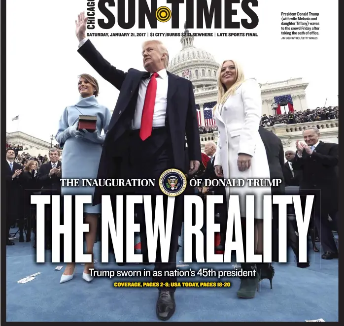  ?? JIM BOURG/ POOL/ GETTY IMAGES ?? President Donald Trump ( with wife Melania and daughter Tiffany) waves to the crowd Friday after taking the oath of office.