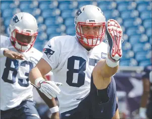  ?? AP PHOTO ?? New England Patriots tight end Rob Gronkowski warms up during an NFL football practice Tuesday in Foxborough, Mass.