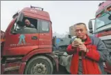  ?? SI WEI / FOR CHINA DAILY ?? A truck driver has breakfast during a break on Nov 14, 2016.