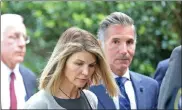  ?? Stuart caHill / boston Herald file ?? actress lori loughlin and her husband, mossimo giannulli, are seen outside court in the seaport after a hearing in their ‘Varsity blues' fraud case.