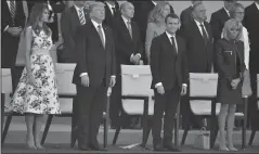  ?? LIONEL HAHN/ABACA PRESS FILE PHOTOGRAPH ?? President Donald Trump, first lady Melania Trump and French President Emmanuel Macron with Brigitte Macron attend the annual Bastille Day military parade on the Champs-Elysees avenue in Paris on July 14, 2017.