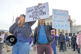  ?? AP PHOTO/AMANDA ANDRADE-RHOADES ?? Anti-abortion protestors rally Tuesday outside the Supreme Court in Washington.