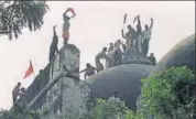  ?? AFP/FILE ?? Hindu activists atop the Babri masjid in Ayodhya shortly before demolishin­g it