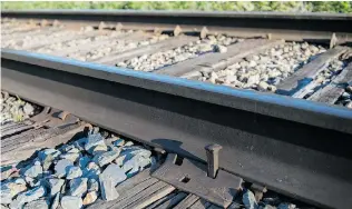  ?? JUSTIN TANG/ POSTMEDIA NEWS FILES ?? This photo of a section of train track south of Lacourcièr­e Street in Lac- Mégantic was taken six days after the derailment. A warrant obtained by Quebec police during their investigat­ion last year was unsealed Friday, giving details for the first time...