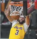  ?? AP file photo ?? Anthony Davis became the eighth player in basketball history to win an NCAA championsh­ip, an Olympic gold medal and an NBA ring last season.