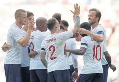  ?? REUTERS ?? England’s Harry Kane, right, celebrates his goal against Nigeria with teammates.